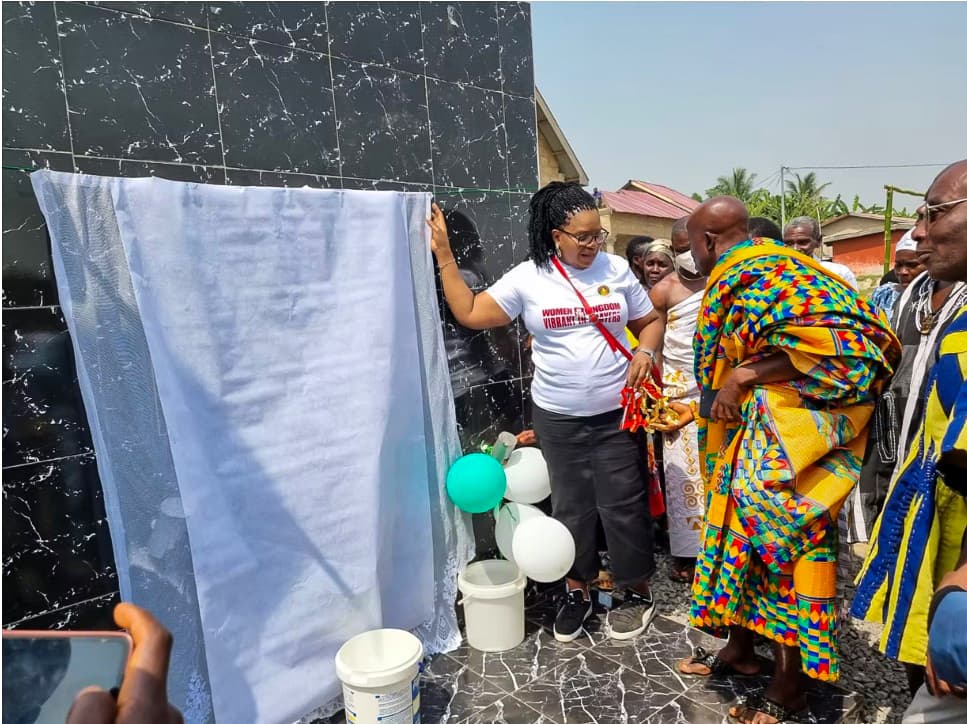Unveiling the dedication plaque at the Women of the Kingdom borehole water project