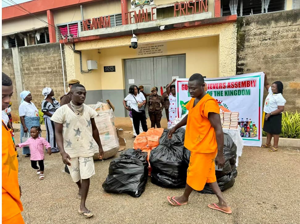 Inmates receiving donated food and provisions at Nsawam Female Prison
