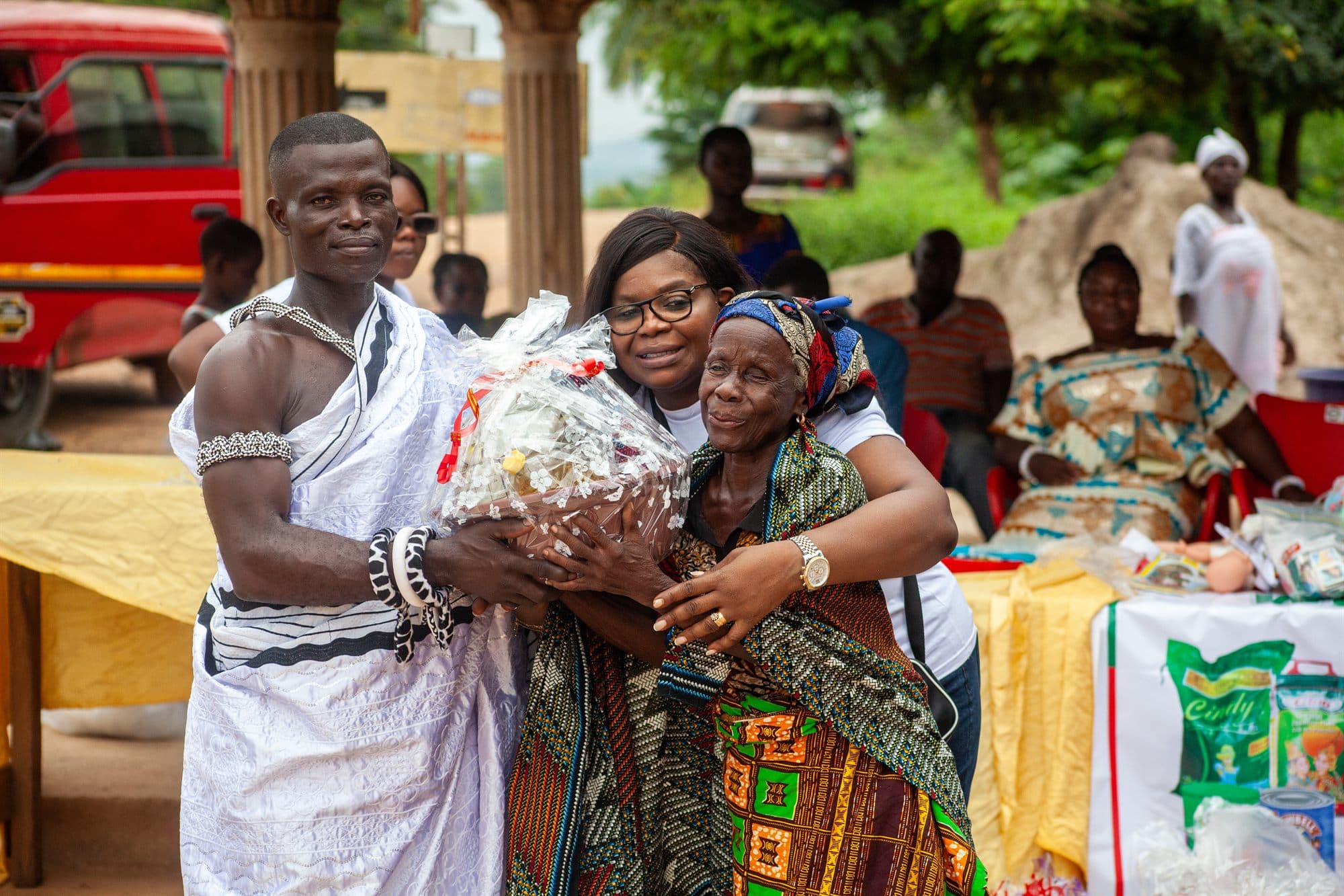 Community members receiving wrapped gift hampers at a Women of the Kingdom outreach
